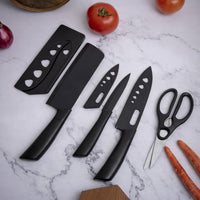 Elegant 4-Piece Stainless Steel Knife Set -Black with Heart Shaped blade covers.